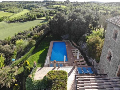 an aerial view of a house with a swimming pool at Sant Grau ii in Navés