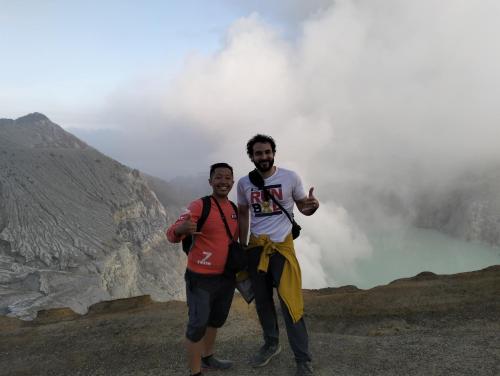 two men standing on the top of a mountain at Nio Homestay and Tour in Licin