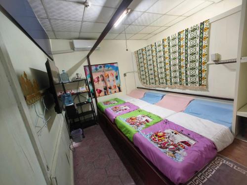 Postel nebo postele na pokoji v ubytování Anping Sucess BnB