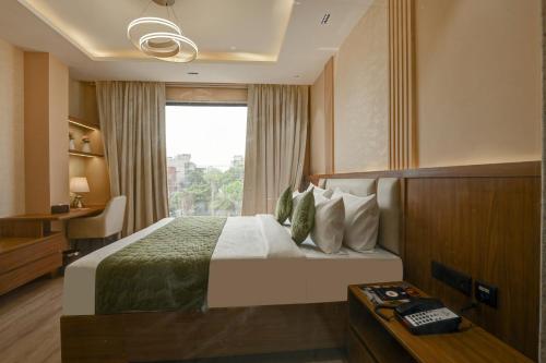 En eller flere senge i et værelse på Hotel 91 City Centre