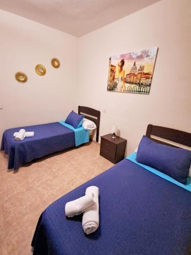 Letto o letti in una camera di Hostal Doña María