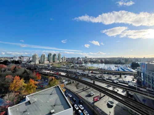 a view of a city with traffic on a highway at Condo Downtown Vancouver - Near Rogers Arena & BC Place w Parking in Vancouver