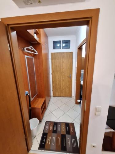 a room with a door and a tile floor at Sunny Apartman in Siófok