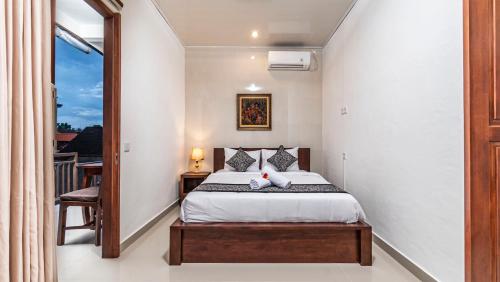 Postel nebo postele na pokoji v ubytování Teba Kauh Ubud