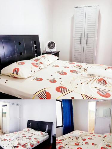 a bedroom with a bed with a comforter on it at Mom's House Colombia Casa 2 in Cali