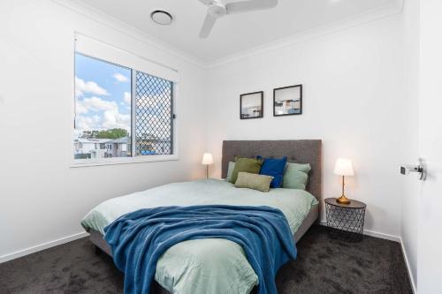 Ένα ή περισσότερα κρεβάτια σε δωμάτιο στο Brisbane Family House with Ensuite&Centralised A/C