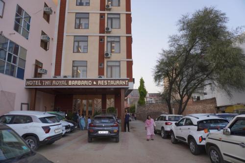 a group of cars parked in front of a building at Hotel The Royal Barbariq in Khātu