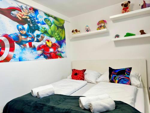 a bedroom with a spider man poster on the wall at Mese Panzió Zalakaros in Zalakaros