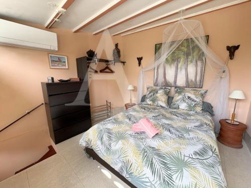 Postel nebo postele na pokoji v ubytování Villa T2 avec piscine privee