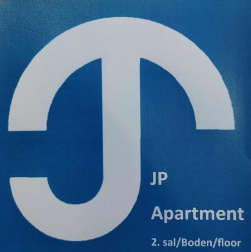 a blue and white parking sign with the letter p at JP Apartment Floor 2 in Grindsted