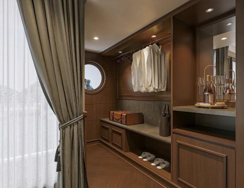 a walk in closet with a window and a curtain at Paradise Legacy Cruise Halong in Ha Long