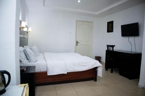 Katil atau katil-katil dalam bilik di Option one hotel and suite