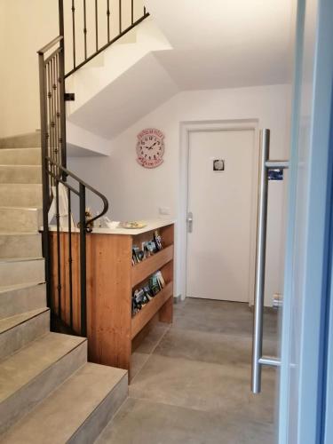 a staircase in a home with a wine cellar at Affittacamere Mercedes in Romallo