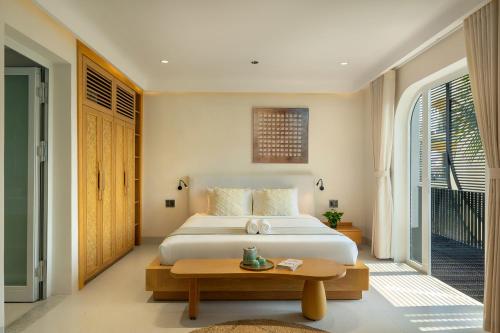 Cama o camas de una habitación en Miss Hoi An villa by Class6