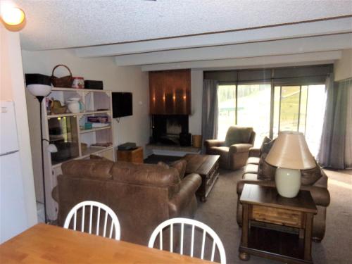 a living room with a couch and a table at Snowflake 1 Bed plus Den 2 Bath SFAF in Copper Mountain