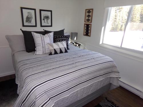a bedroom with a bed with pillows and a window at Blue River Condos 3 Bed 2 Bath BRLR in Blue River