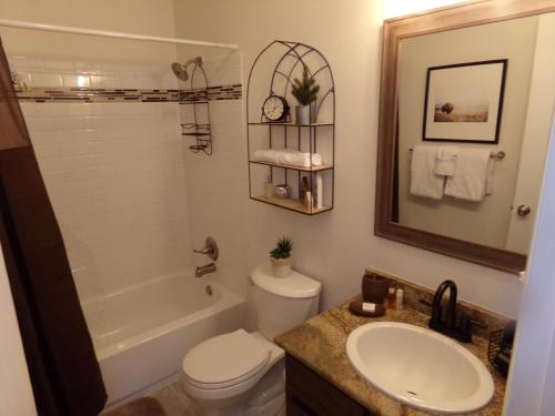 a bathroom with a sink and a toilet and a tub at Blue River Condos 3 Bed 2 Bath BRLR in Blue River