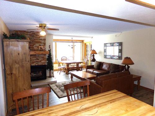 a living room with a couch and a table at Summit House 2 bed 2 bath SHGW in Copper Mountain