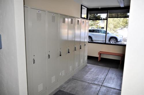 a row of lockers in a room with a car parked at Summit House 2 bed 2 bath SHGW in Copper Mountain