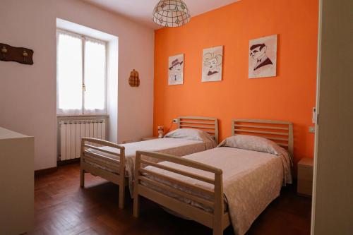Postel nebo postele na pokoji v ubytování Margherita Guest House