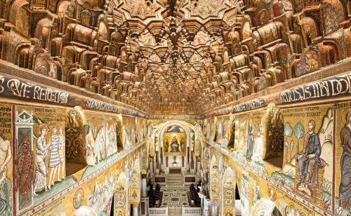 a room with paintings on the walls of a church at Grazioso appartamento non lontano dal mare in Trappeto