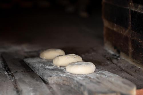 a group of four donuts sitting on a table at Land of Alandroal in Alandroal