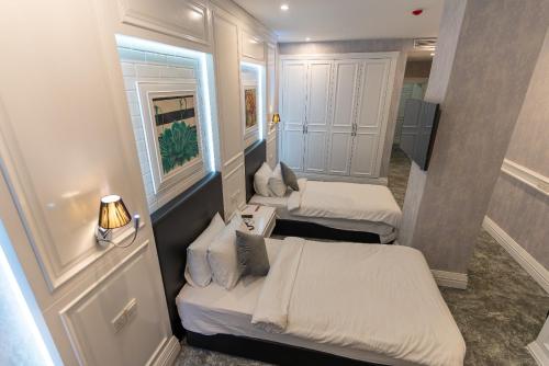 Ein Bett oder Betten in einem Zimmer der Unterkunft The Best Time Hotel