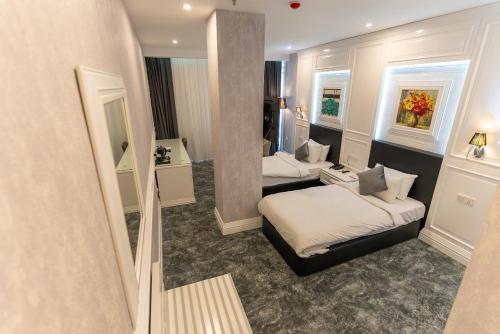 Ein Bett oder Betten in einem Zimmer der Unterkunft The Best Time Hotel