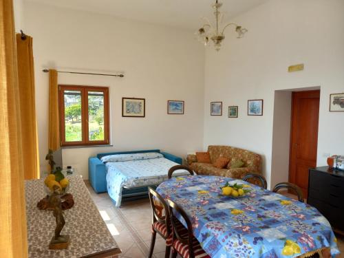a living room with a bed and a table at Paradiso amalfi house in Amalfi