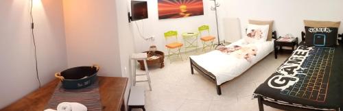 a small living room with a bed and a couch at Irini in Thérissos