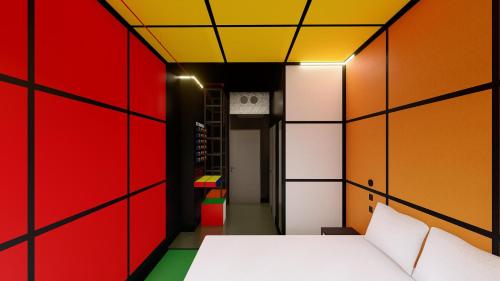 a room with colorful walls and a bed in the middle at JO&JOE Budapest in Budapest