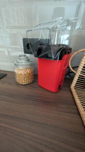 a red basket sitting on top of a table at Ház a Hold utcában in Kehidakustány
