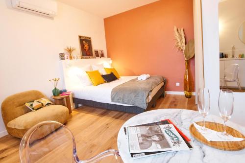 Ένα ή περισσότερα κρεβάτια σε δωμάτιο στο Chez Camille - Boutique Aparthotel au coeur de Bordeaux