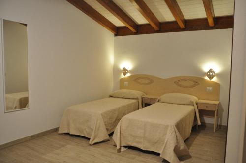 Postel nebo postele na pokoji v ubytování Agriturismo Sa Scalitta