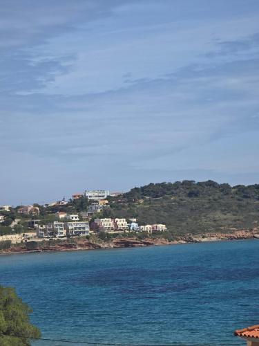 a view of a body of water with houses at GLIPTIS Apartments in Karfas
