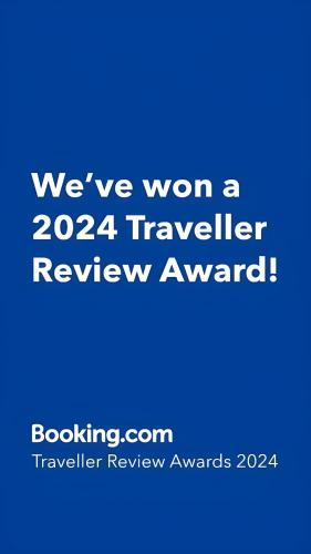 a blue sign that says weve won a traveler review award at OPERA LUX APARTMENTS - Green Hill kompleks Sokobanja & Free Parking - kod Akva Parka in Soko Banja