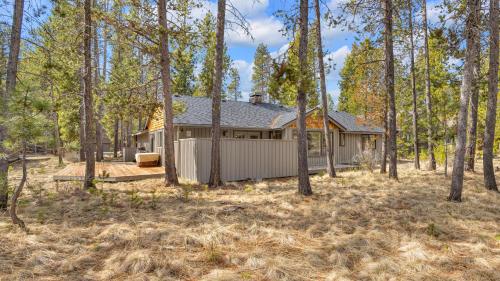 a house in the woods with trees at Kinglet - Unit 46 in Sunriver