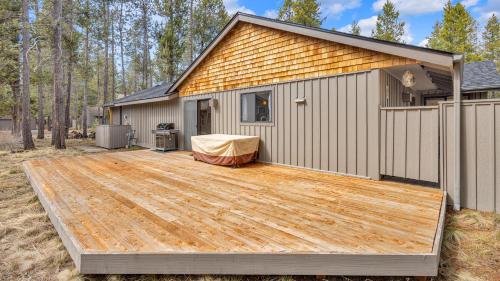 a wooden deck in front of a house at Kinglet - Unit 46 in Sunriver