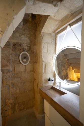 a bathroom with a sink and a mirror at Fjore di Lecce, camere & caffè in Lecce