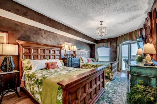 a bedroom with a bed with a wooden headboard at Ocean Blue 902 in Myrtle Beach