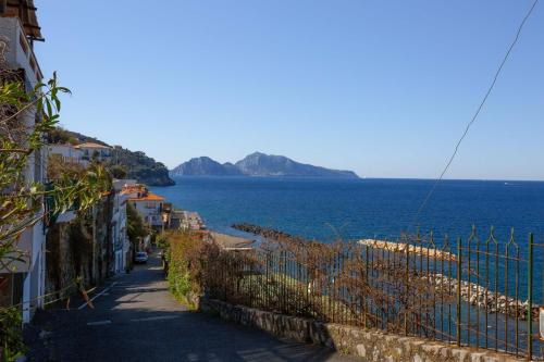 a street with a view of the ocean and buildings at Estate4home - Suite Bonview in Massa Lubrense