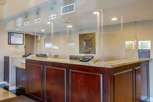 a lobby with a counter with phones on it at Comfort Inn & Suites Huntington Beach in Huntington Beach