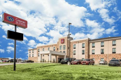 a building with a sign in front of it at Comfort Suites Dodge City in Dodge City