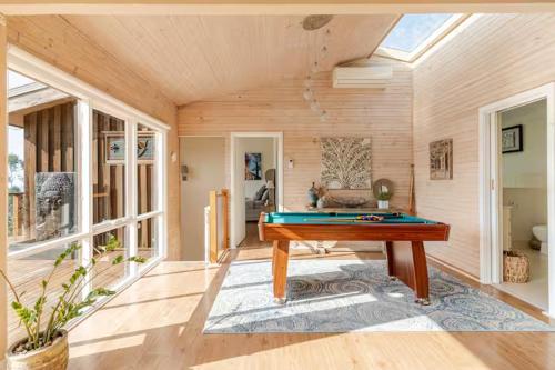 a pool table in the middle of a room at Villa with Spa and Breathtaking Views of Dandenong Ranges in Kalorama