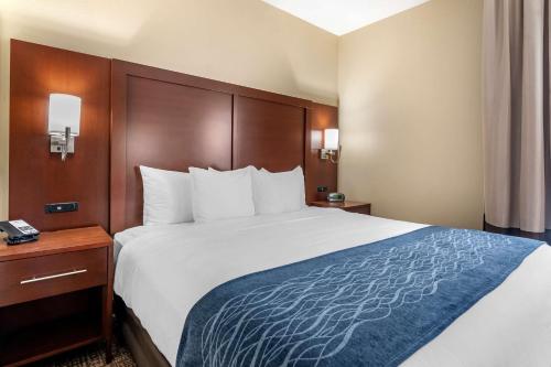 a bed in a hotel room with a large bed at Comfort Inn & Suites Junction City - near Fort Riley in Junction City