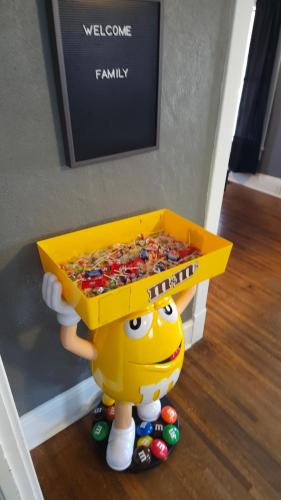 a toy person holding a box of candy at Huge 4-Bedroom Historic Home & Game Room in Goldsboro