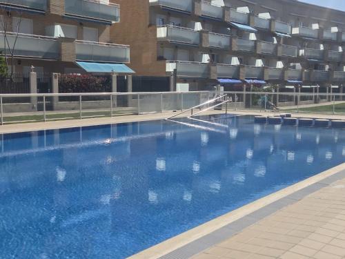 a large swimming pool in front of a building at RELAX-Apt in Benicarló