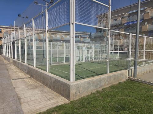 a building with a tennis court inside of it at RELAX-Apt in Benicarló