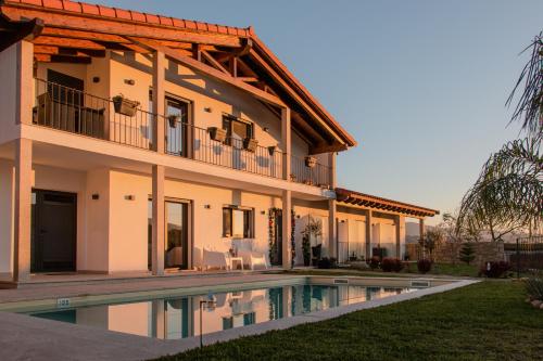 a house with a swimming pool in front of it at Casa Serra De Soajo in Soajo
