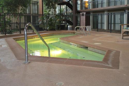 a swimming pool with a green liquid in it at Radisson Hotel Lenexa Overland Park in Lenexa